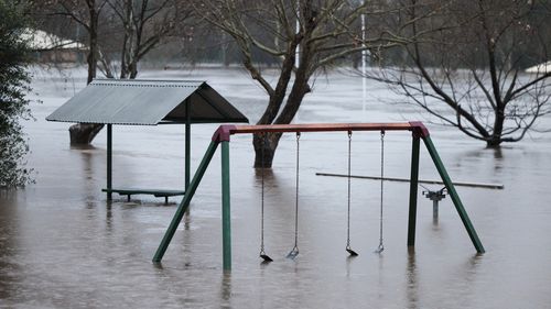 Low-lying parts of Singleton are inundated by flood waters along the Hunter River.