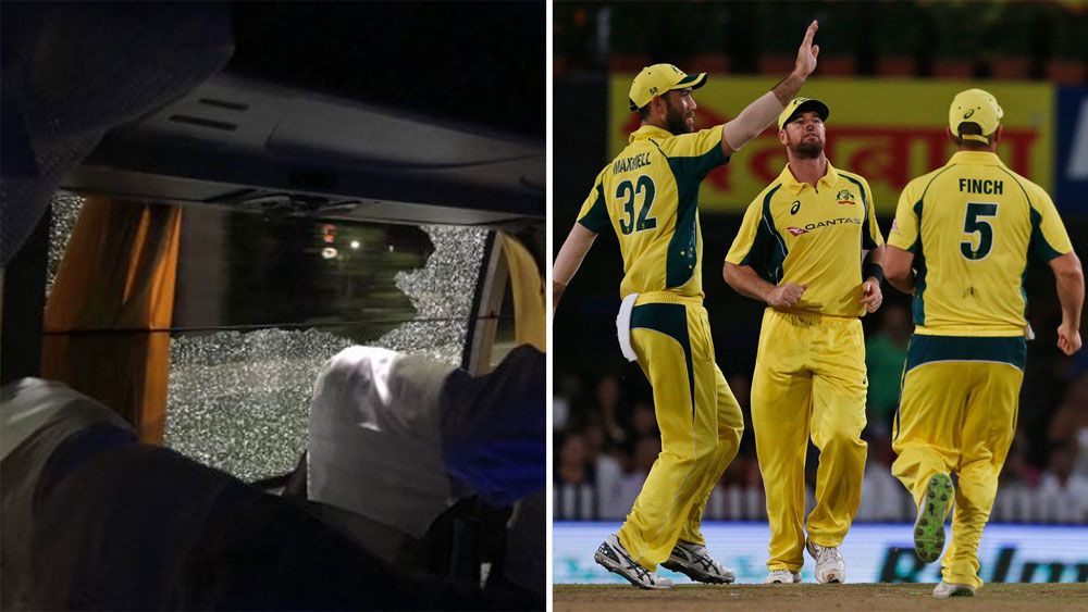 Two arrested over Aussie cricket rock toss