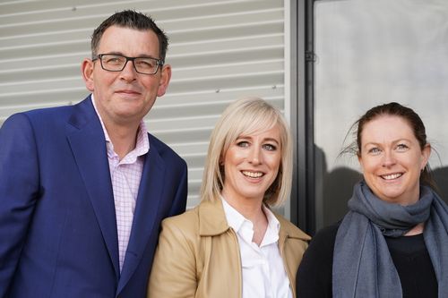 The premier was joined by wife Catherine (centre) at the announcement this morning.