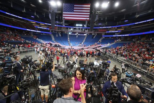 Trump supporters begin to take their seats inside the Amway Centre before the President Trump campaign rally in downtown Orlando.