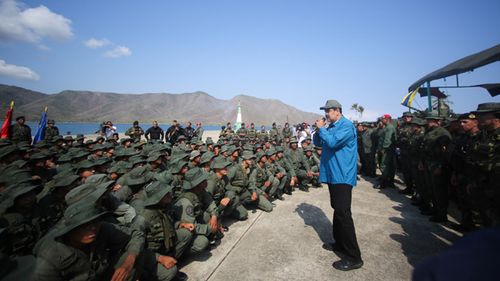 Venezuelan President Nicolas Maduro speaks to members of the military, in Turiamo, Venezuela, where he asked troops to take care of the 'union' and 'loyalty' to the National Armed Forces. 