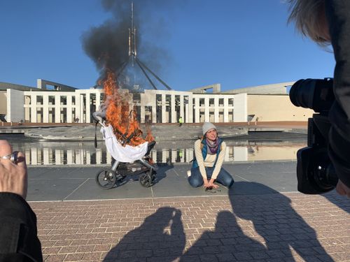 A climate protest has ramped up outside Parliament House following a climate change report.