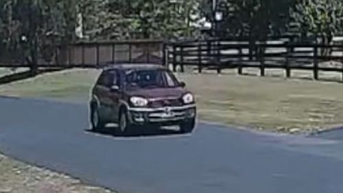 Photo released by police of a maroon 2002 Toyota Rav 4, with yellow and black New South Wales registration plates. 