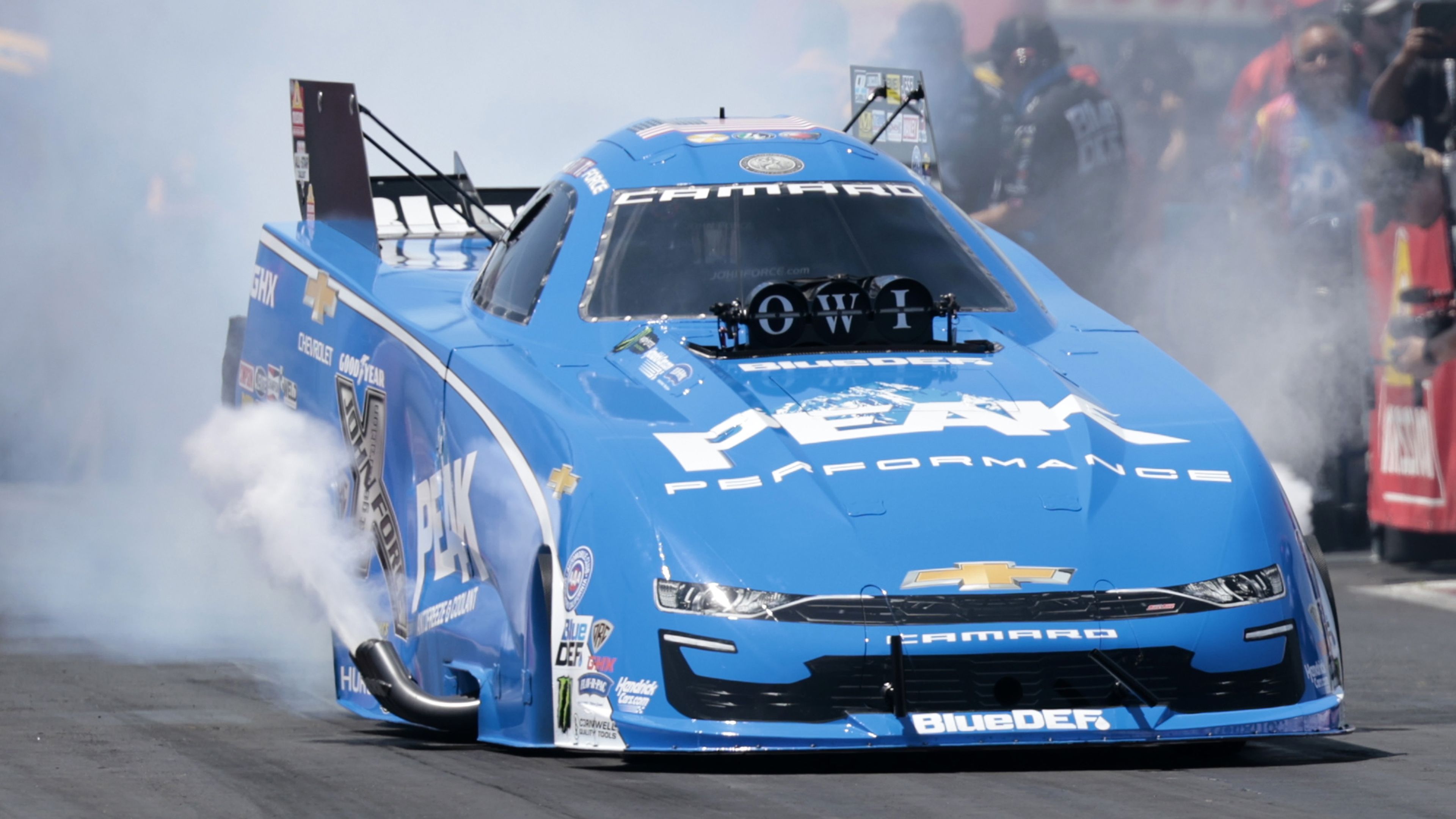 John Force, of Yorba Linda, CA, driving a JFR 500 Peak Chevy &#x27;22 Camaro SS smokes the tires in Fuel Funny Car qualifying during the NHRA New England Nationals on June 2, 2024, at New England Dragway in Epping, New Hampshire. (Photo by Fred Kfoury III/Icon Sportswire via Getty Images)