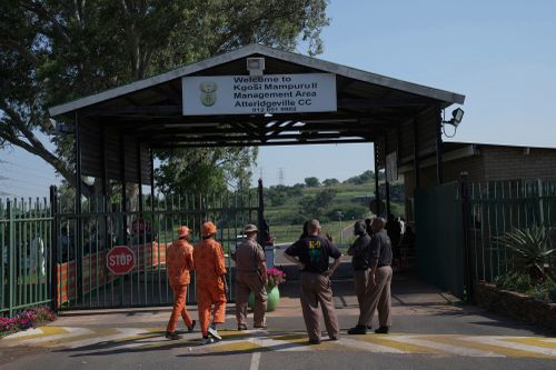 K-9 officers gather at the entrance of Atteridgeville Prison where Oscar Pistorius is being held, ahead of a parole hearing in Pretoria, South Africa, Friday, Nov. 24, 2023.