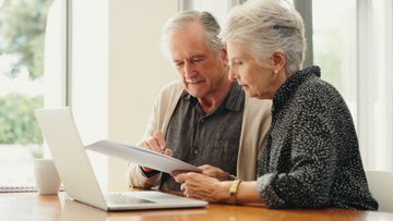 Senior couple sorting out finances