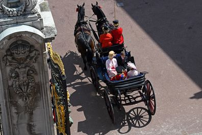 Britain's Prince Edward, Sophie, Countess of Wessex, Lady Louise Windsor and James, Viscount Severn, travel in a horse-drawn carriage.