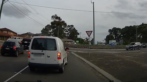 The driver of a ute has posted dash cam footage of a white van's prang on a Sydney road after an apparent dispute over who was in the wrong.