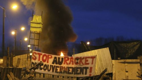 The French government caved in after the worst riots in decades and delayed an increase in energy taxes 