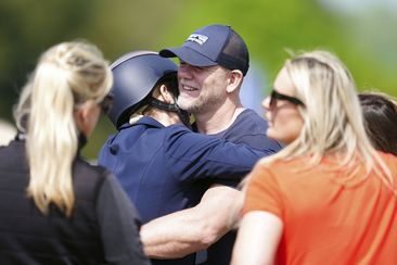 Zara Tindall hugs her husband Mike, on day two of the Badminton Horse Trials 2024 at the Badminton Estate in Badminton, England, Thursday, May 9, 2024 