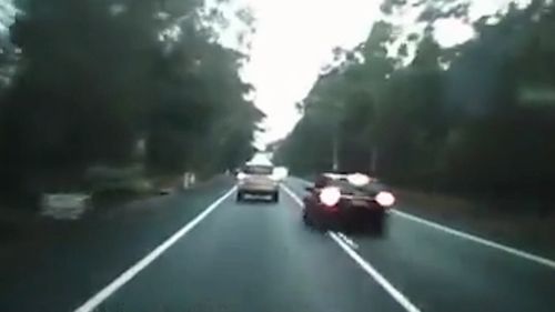 The driver was caught on dashcam overtaking across double lines. Picture: Supplied