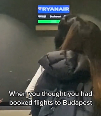 TikToker SopheAlice lining up for her flight to Bucharest instead of Budapest.