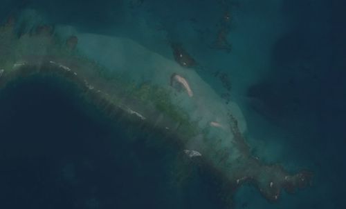 The aerial photo of the Hawaii East Island shows how it became almost completely submerged after the hurricane.