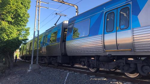 Some passengers chose to jump from the stationary trains to escape. (Sean Davidson)