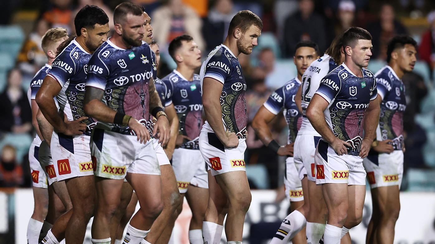 Cowboys players look dejected after a Tigers try.