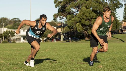 South Sydney Rabbitohs player Liam Knight and Cronulla Sharks player Toby Rudolph keep each other motivated ahead of the NRL season which has been delayed due to Coronavirus. Photographed at Heffron Park, Maroubra.