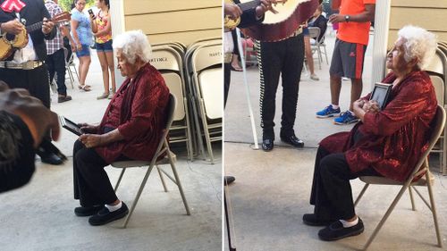 Grandmother hugs photo of husband in moving portrait of loss and devotion