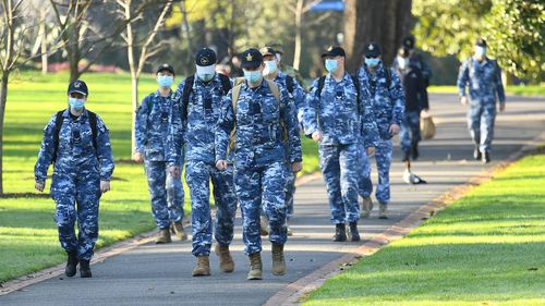 Members of the Australian Defence Force walk through Fitzroy Gardens on August 10, 2020 in Melbourne, Australia.  