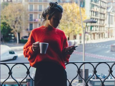 Woman texting at home