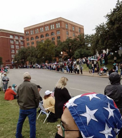 QAnon followers gathered in Dealey Plaza next to where John F Kennedy was killed in 1963.