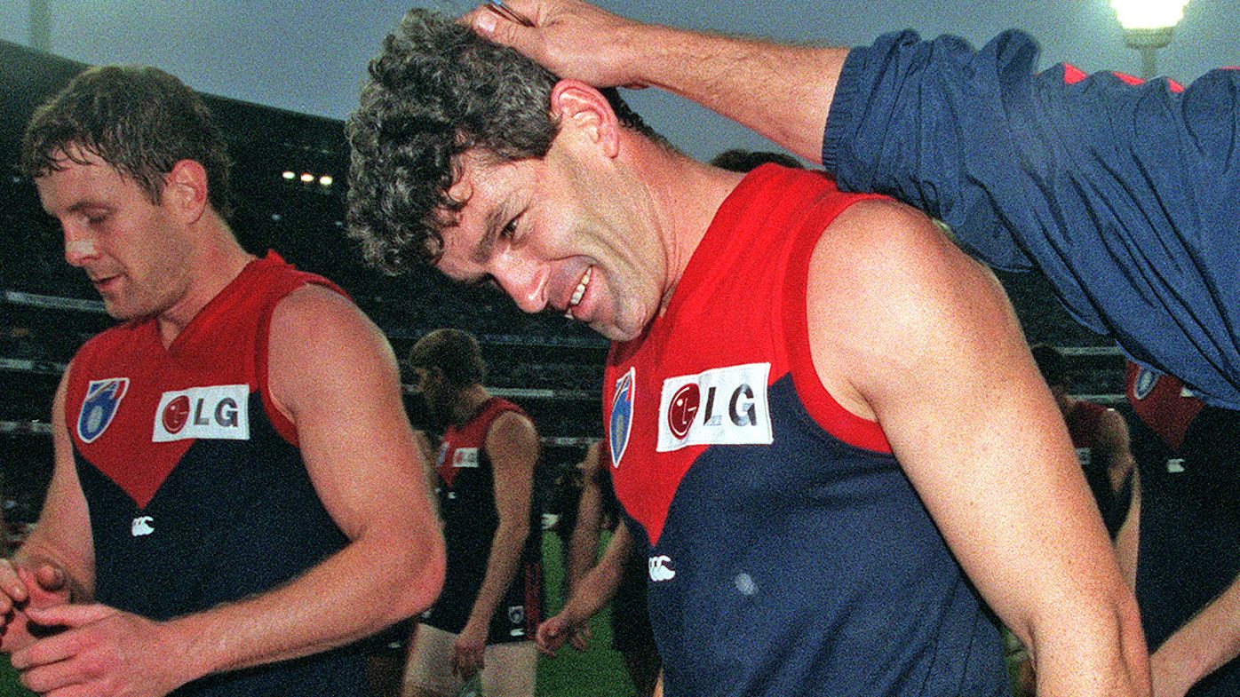 Melbourne celebrate a win, with Shaun Smith scoring 5 goals