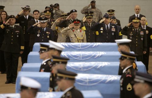 In this April 12, 2007, file photo, delegates of countries which participated in the Korean War salute the United Nations flag-covered coffins of six U.S. soldiers from the Korean War, during a tentative repatriation ceremony at a U.S. military base in Seoul. From 1996 to 2005, joint U.S.-North Korea military search teams conducted 33 recovery operations that collected 229 sets of American remains. The last time North Korea turned over remains was in 2007, when Bill Richardson, a former U.N. ambassador and New Mexico governor, secured the return of six sets. (AP Photo/You Sung-ho, File)