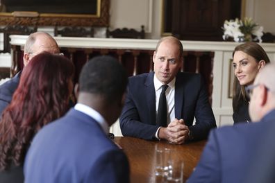 Britain's Prince William and Kate, Princess of Wales, meet volunteers and operational staff who were involved in facilitating the Committal Service for Queen Elizabeth II at St George's Chapel, at Windsor Guildhall, Berkshire, Thursday, Sept. 22, 2022. (Ian Vogler/Pool Photo via AP)