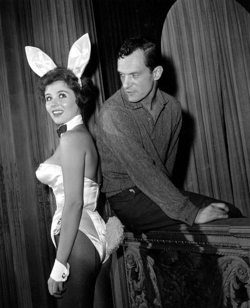 Posing with "bunny-girl" hostess Bonnie J. Halpin at Hefner's nightclub in Chicago, 1961. (AP)