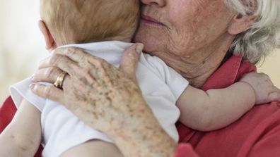 Grandmother holding baby