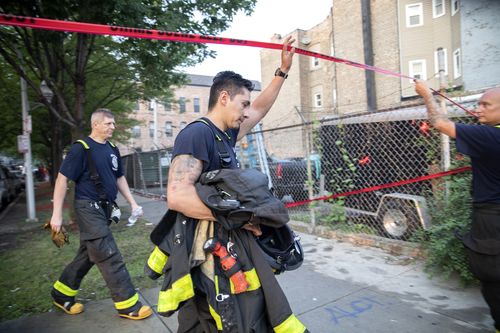 A neighbour returning from work has been hailed a hero, but there were no working smoke alarms in the home.