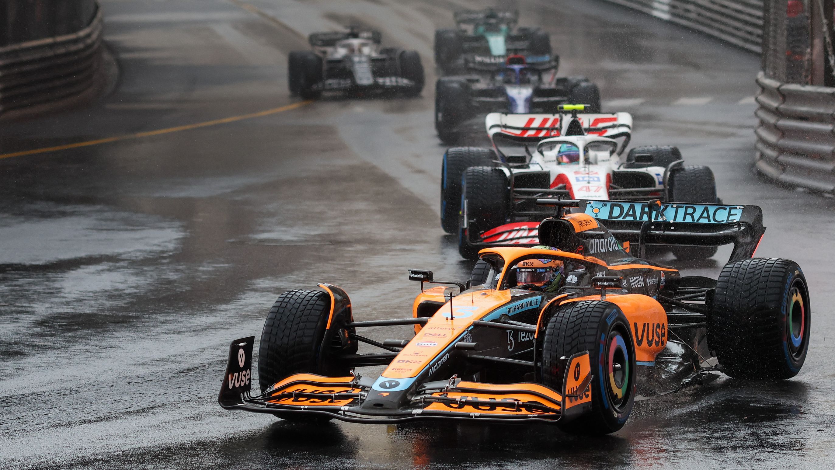Australia&#x27;s Daniel Ricciardo fends off a chasing group at the Monaco Grand Prix.
