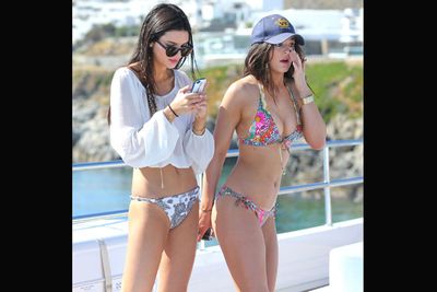 The teenage Kardashian half-sisters show off their bikini bodies on a luxury yacht in Greece. <br/>