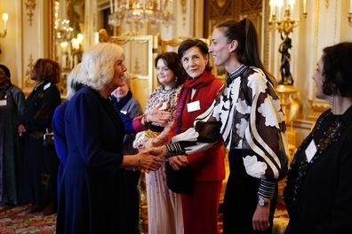 Queen Camilla greets former professional footballer Jill Scott 
