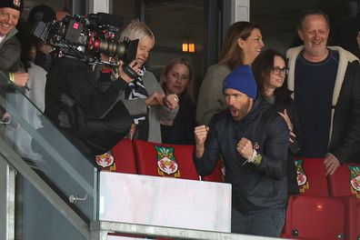 Ryan Reynolds celebrates immediately after full-time as his football club Wrexham wins a crucial league game 3-2 over Notts County. 