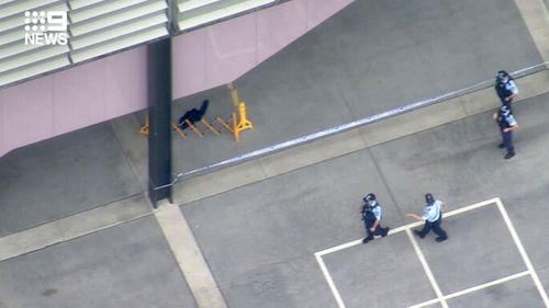 Blood can be seen inside a crime scene at Arthur Phillip High School. The male student was rushed to hospital but is reportedly stable.