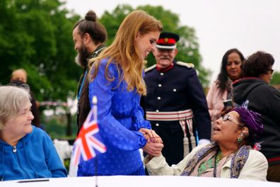 Princess Beatrice talks with a member of the public 