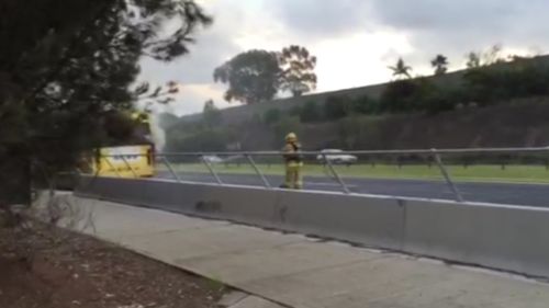 Emergency services rushed to the scene of the fire after smoke was seen pouring from the bus. (9NEWS)