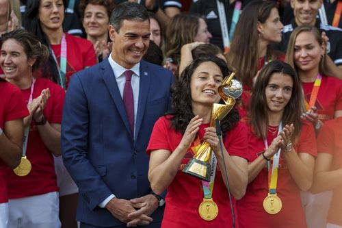 Spain's acting Prime Minister Pedro Sanchez stands with Spain's Women's World Cup soccer team after their World Cup victory, at La Moncloa Palace in Madrid, Spain, Tuesday, Aug. 22, 2023. 