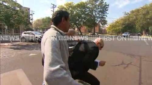 Mr Attwater was chased by supporters of Ms Daley after his court appearance. (9NEWS)