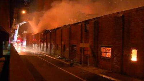 Flames tore through the building beneath Melbourne's iconic Nylex tower overnight. Picture: 9NEWS