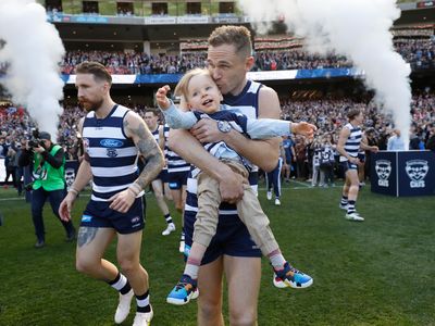 Joel Selwood and Levi Ablett running onto the field for the AFL Grand Final