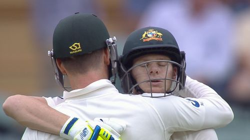 Smith embraces his skipper upon reaching a brilliant hundred. (9NEWS)