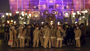 Disneyland employees gather to wait for their COVID-19 tests at the Shanghai Disney Resort in China. 