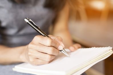 woman writing note