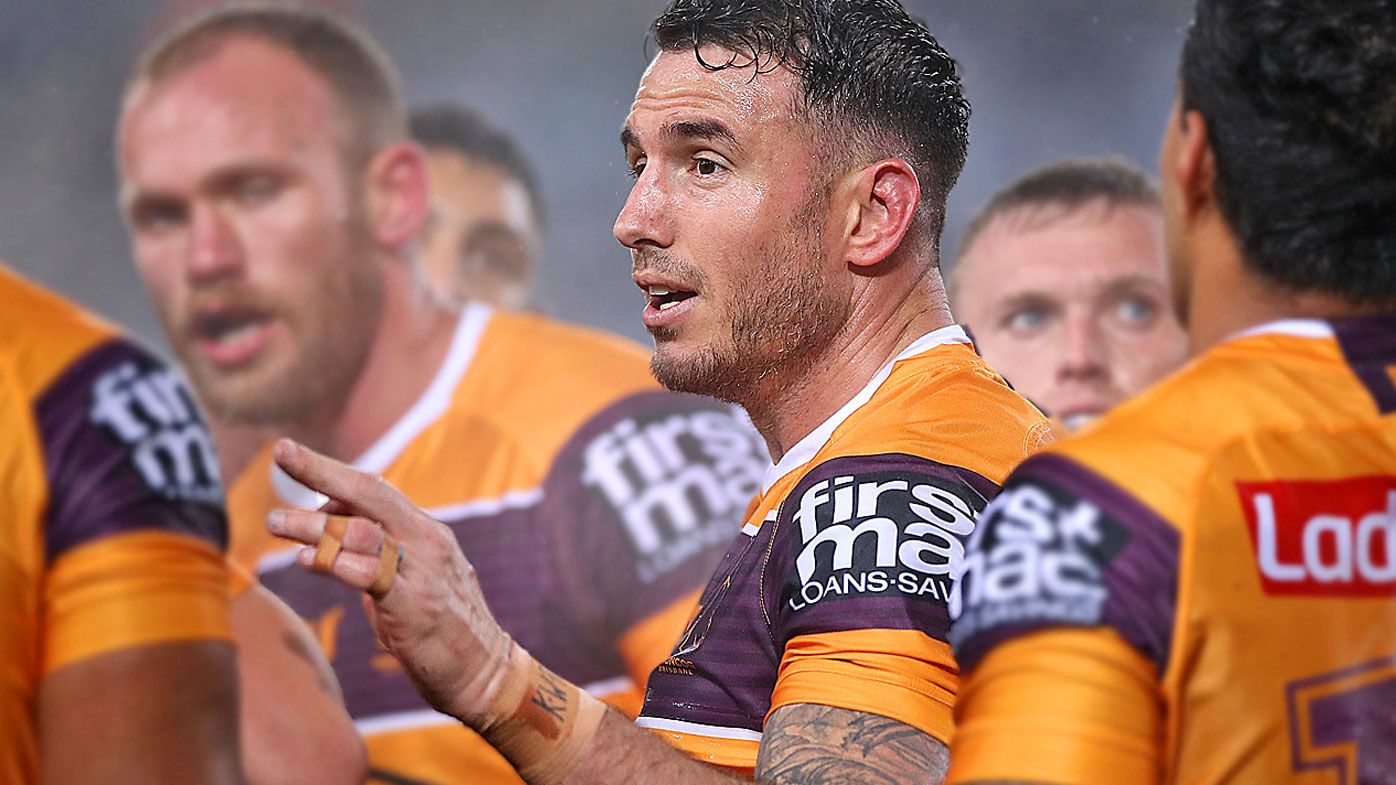 Darius Boyd of the Broncos talks to his players 