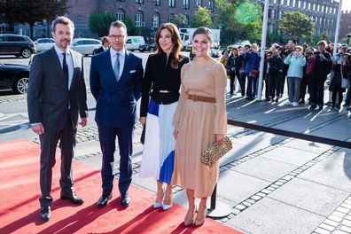 Princess Mary changes her shoes while out with Sweden's Crown Princess Victoria