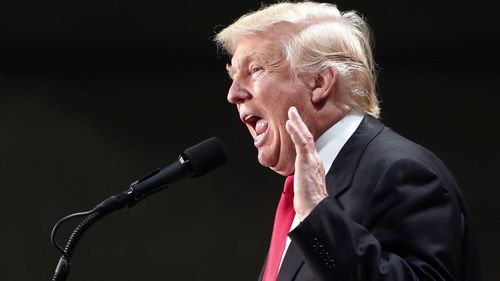 Trump tours flooded Louisiana