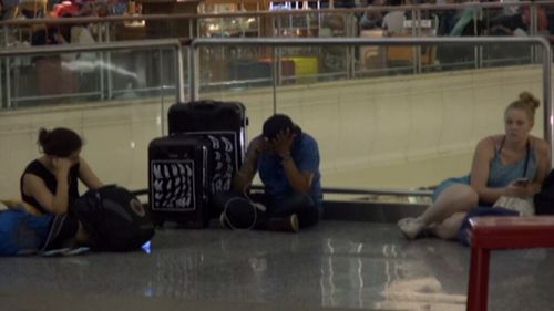 Stranded tourists at Denpasar Airport. 