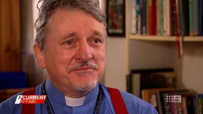 Sydney priest Father Dave Smith prays for help to save boxing gym
