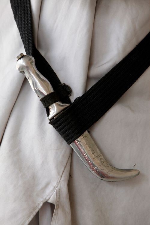 Sikh men are mandated to carry a kirpan - a ceremonial dagger,  generally 8-10 centimetres long, with a blunt point and edges.